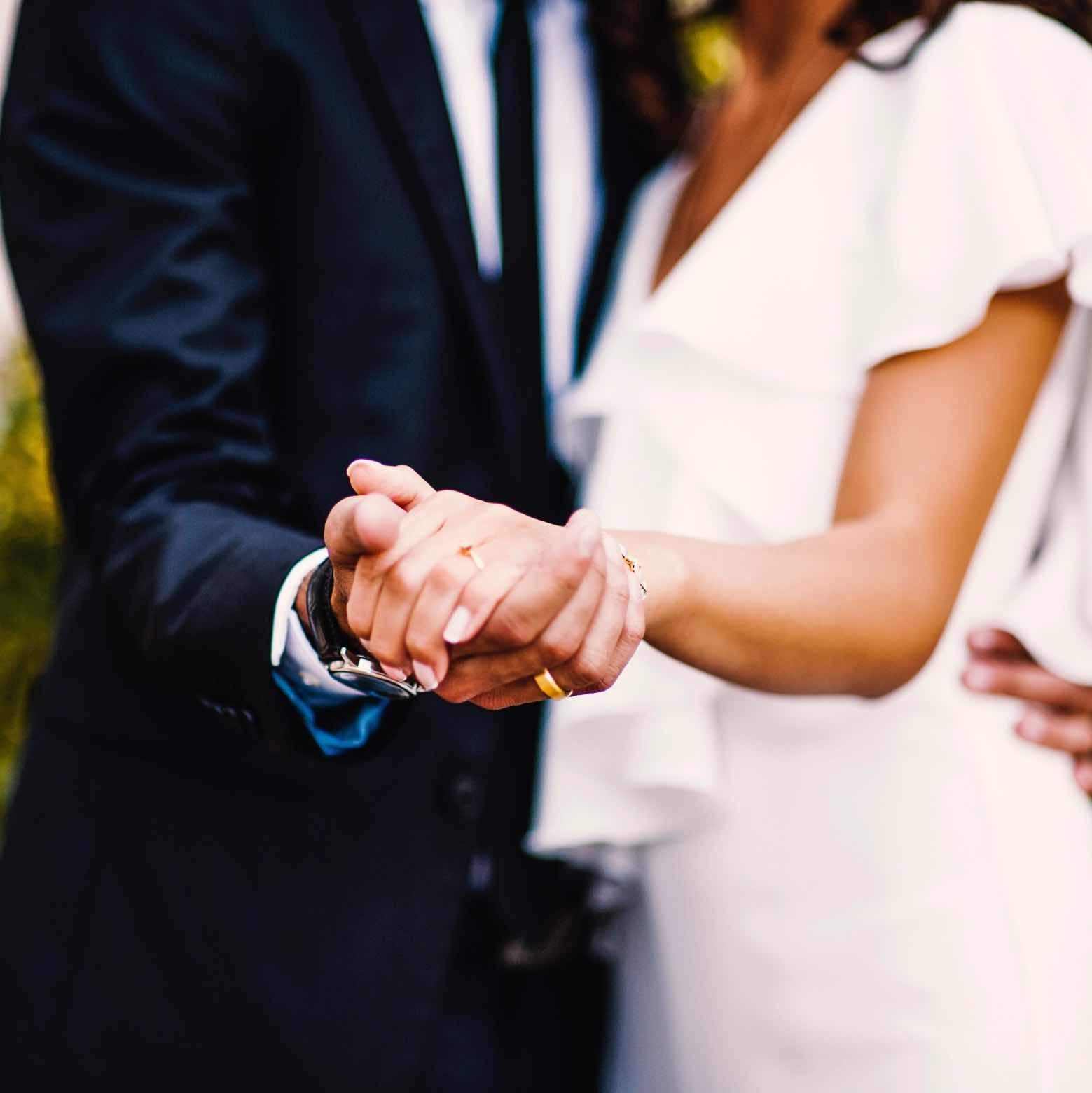 Wedding Photos Bride and Groom Holding Hands