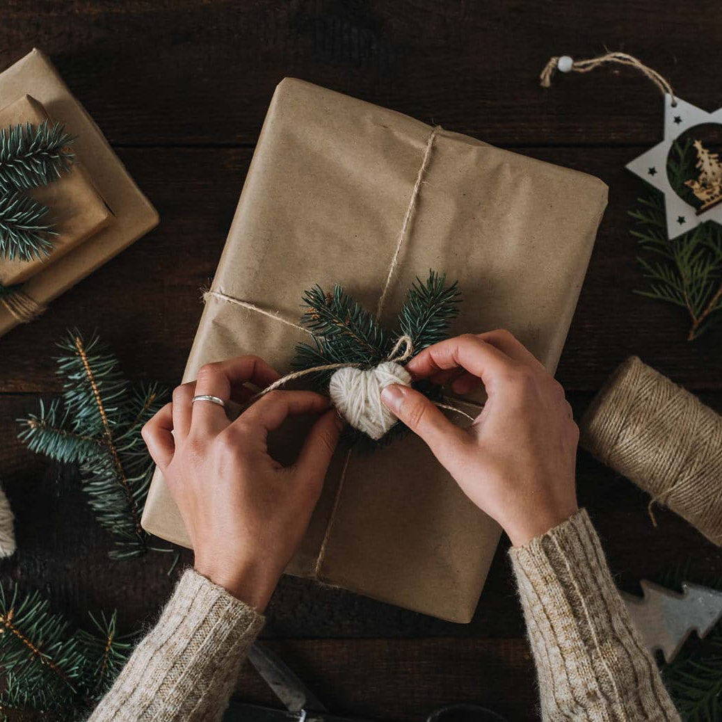 Wrapping a holiday Christmas gift with love